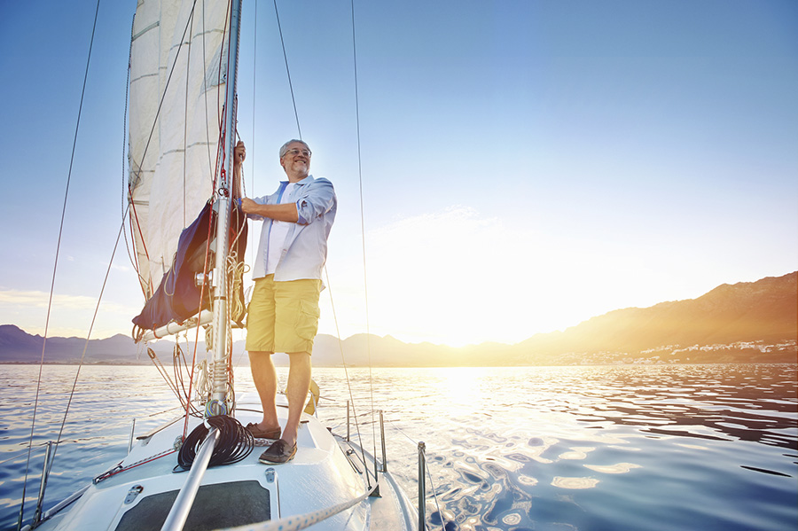 man on sailing boat in water