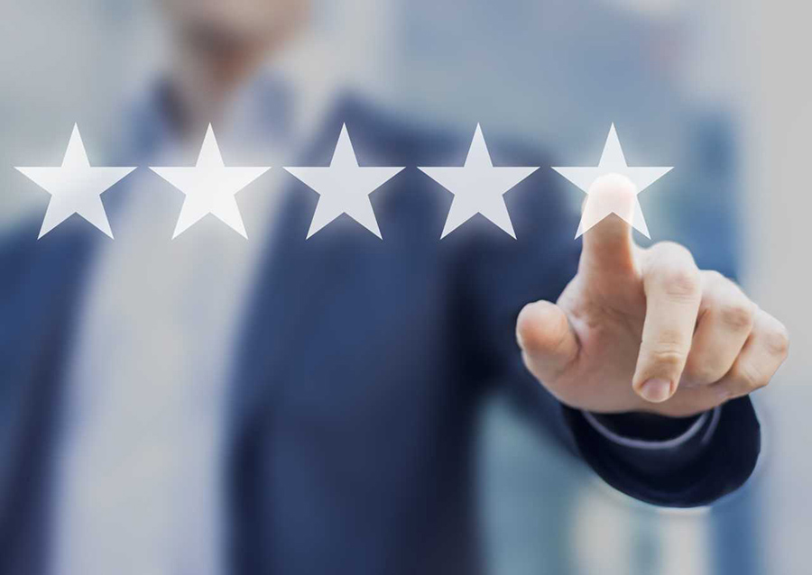 image of man pointing to five stars