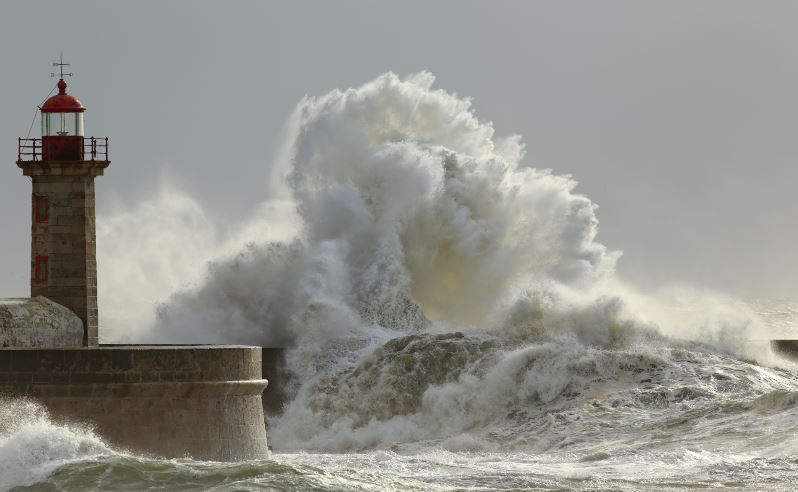 lighthouse and big waves crashing