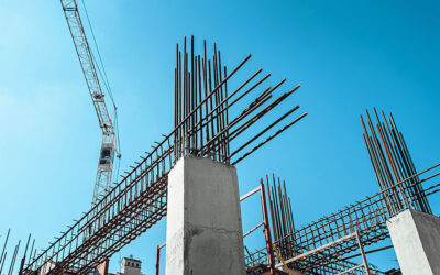 Steel Frames of A Building Under Construction, With Tower Crane On Top