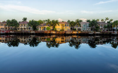 Hollywood beach in north Miami, Florida with Intracoastal water canal Stranahan river and view of waterfront property modern mansions villas houses with palm trees reflection at sunset